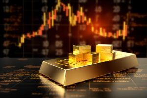 Feature image for precious metals trading featuring gold bars on a table with a monitor showing candlestick financial charts in the background